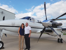 Beechcraft King Air owners pose by their aircraft equipped with Raisbeck Engineering's Composite 5-Blade Swept Propellers